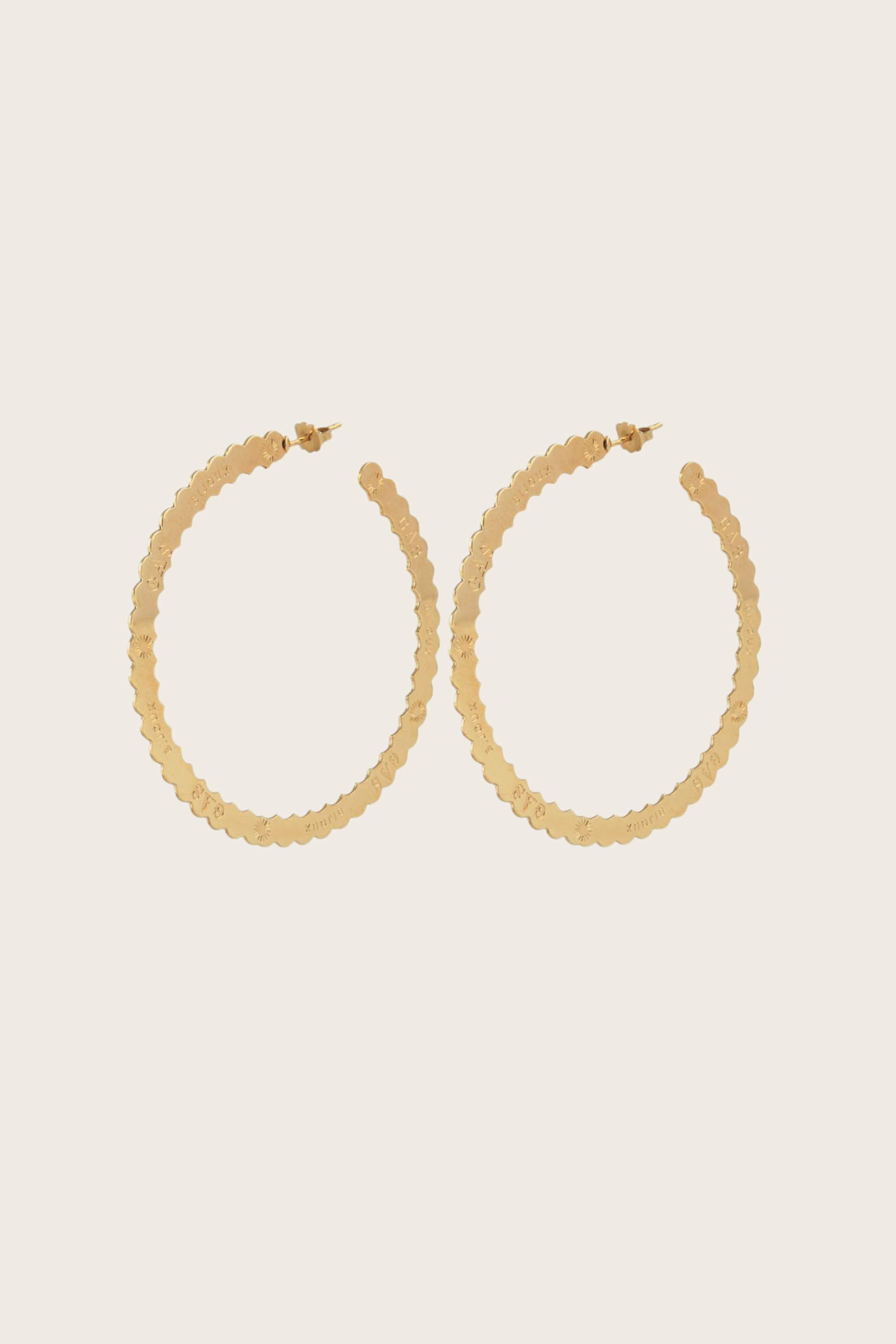 Bolduc hoop earrings, Material: Fine gold-plated metal, Design: Serrated hoop engraved with the Gas Bijoux logo, New Arrivals, FW25, Espace Cannelle