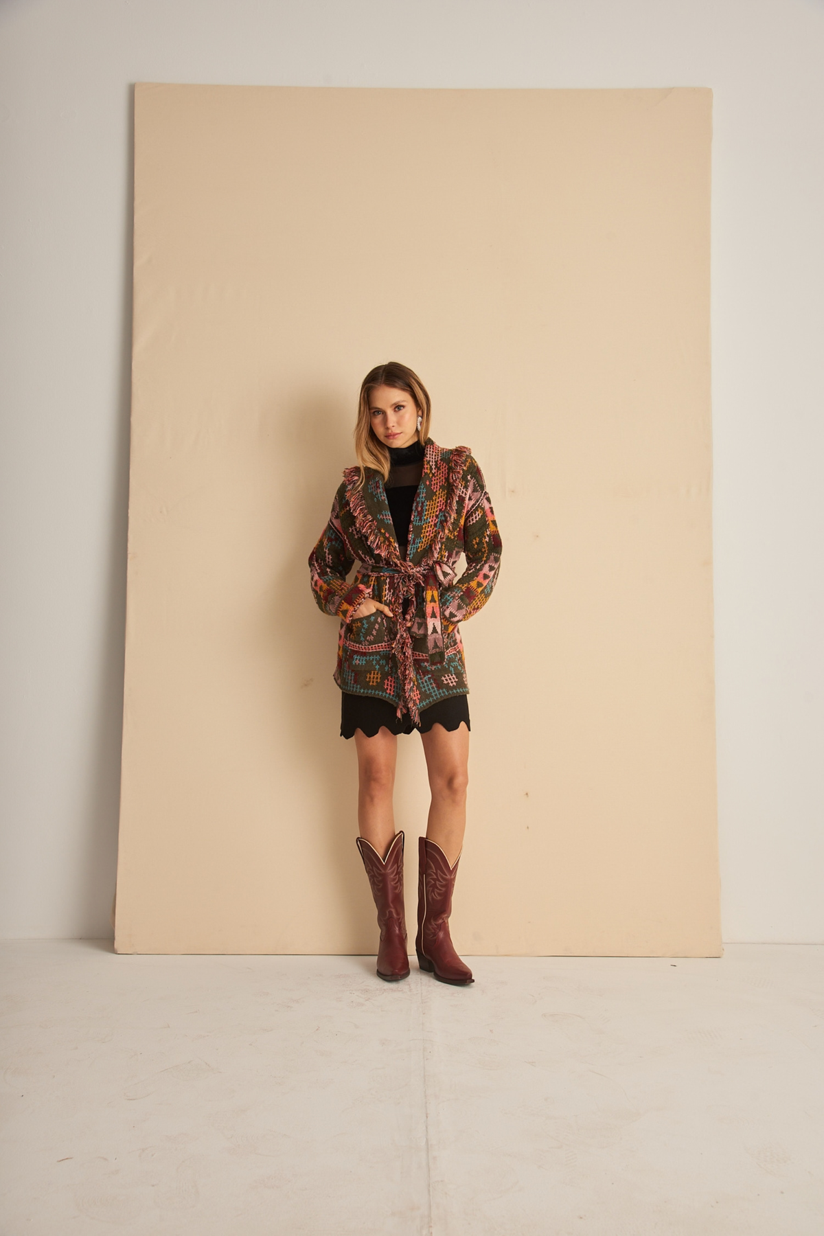 Dri cardigan with multicoloured pattern by Cecilia Prado, front view with model's hands in pockets - espace cannelle