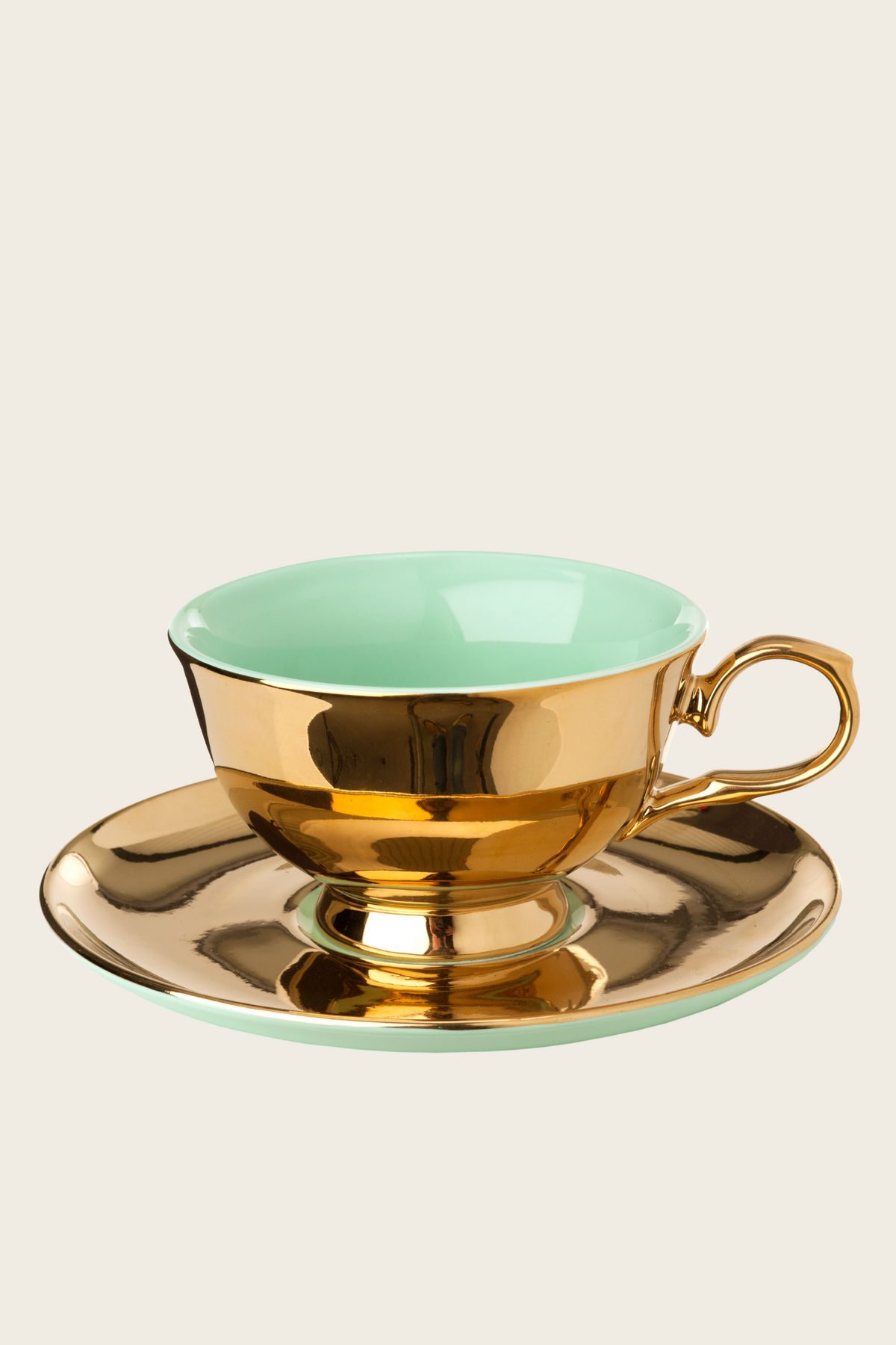 Mint green tea cup and saucer with gold-tone trim
