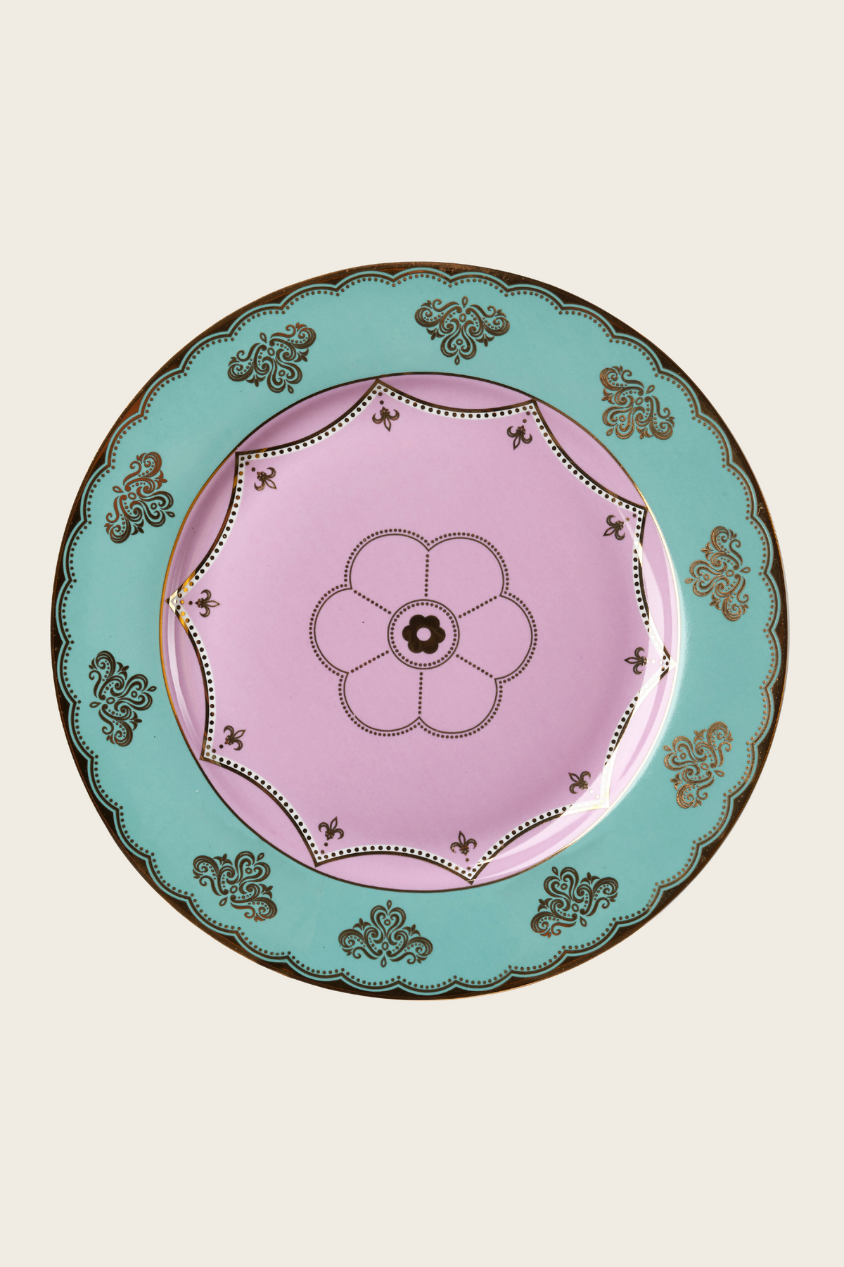 Pink porcelain plate with a turquoise rim and floral centre motif