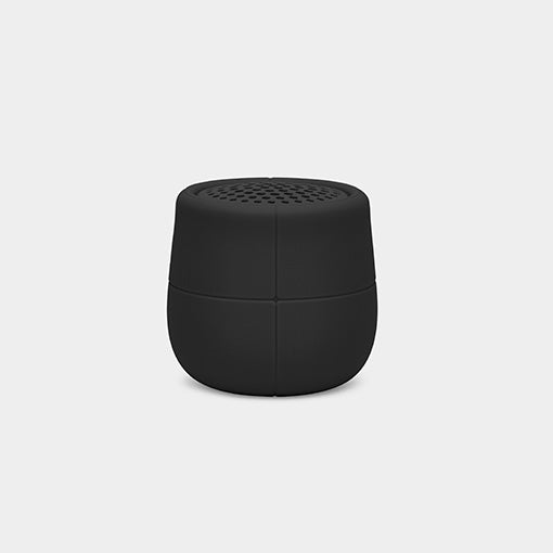 Compact black wireless portable speaker on a plain light background.