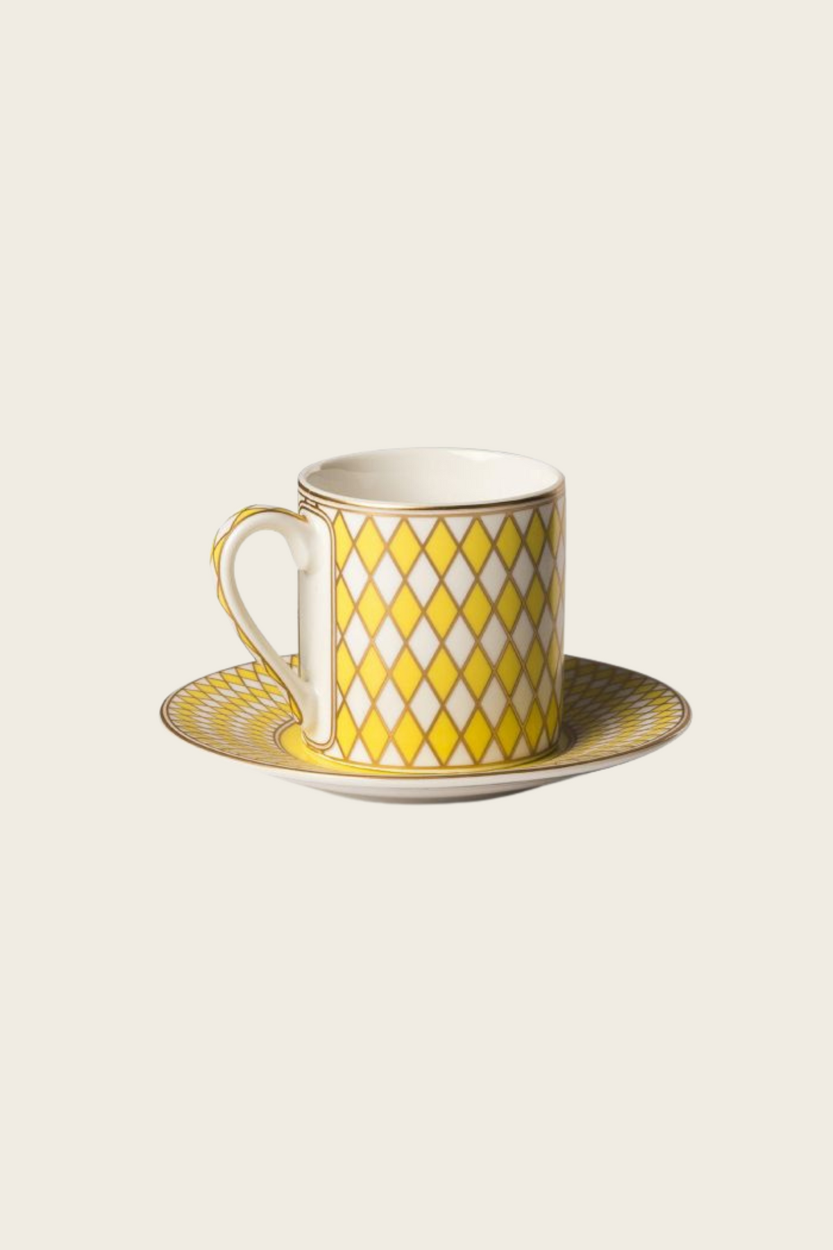 Yellow diamond-patterned Chess espresso cup on a matching saucer