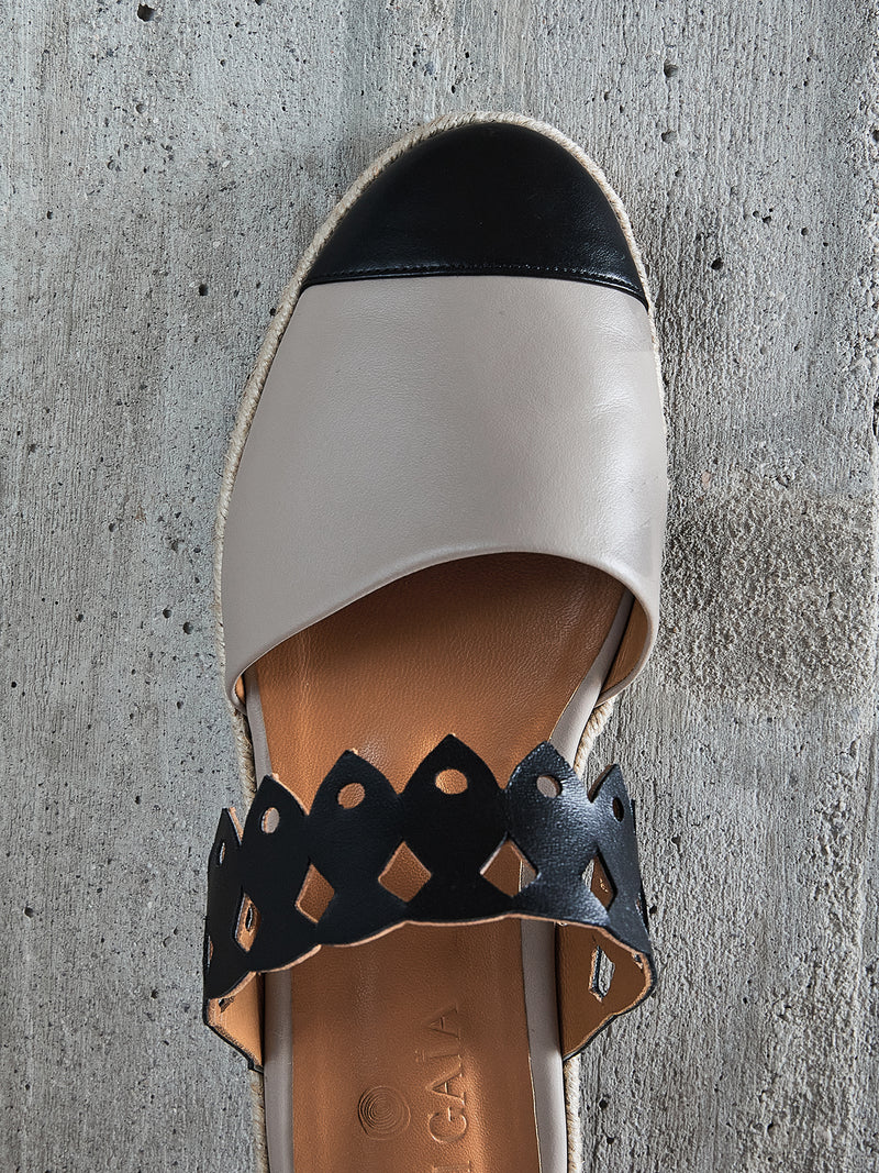 Beige and black Kendra espadrille by Di Gaia, top view showing the black toe cap and fish-shaped cutout strap - espace cannelle