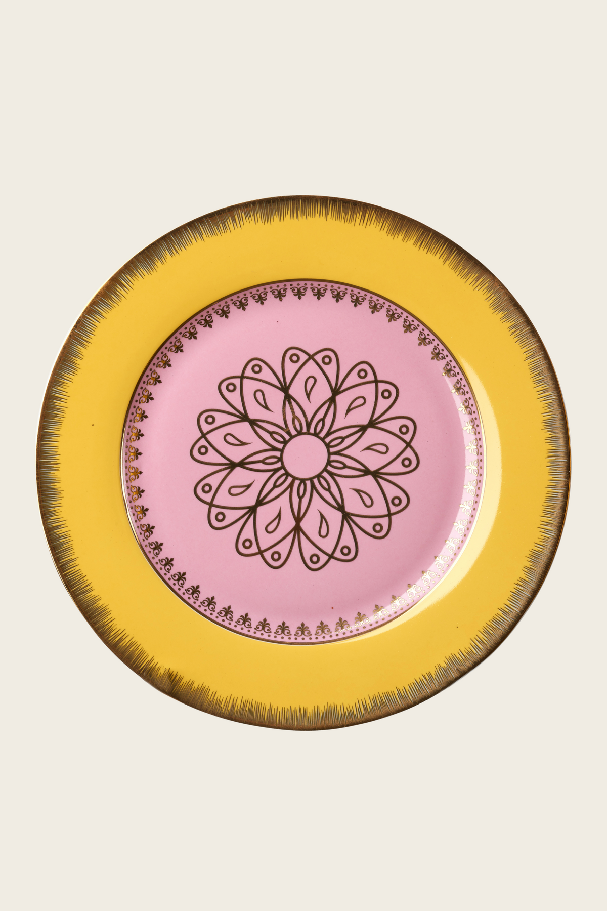 Pink porcelain plate with a yellow rim and floral centre motif