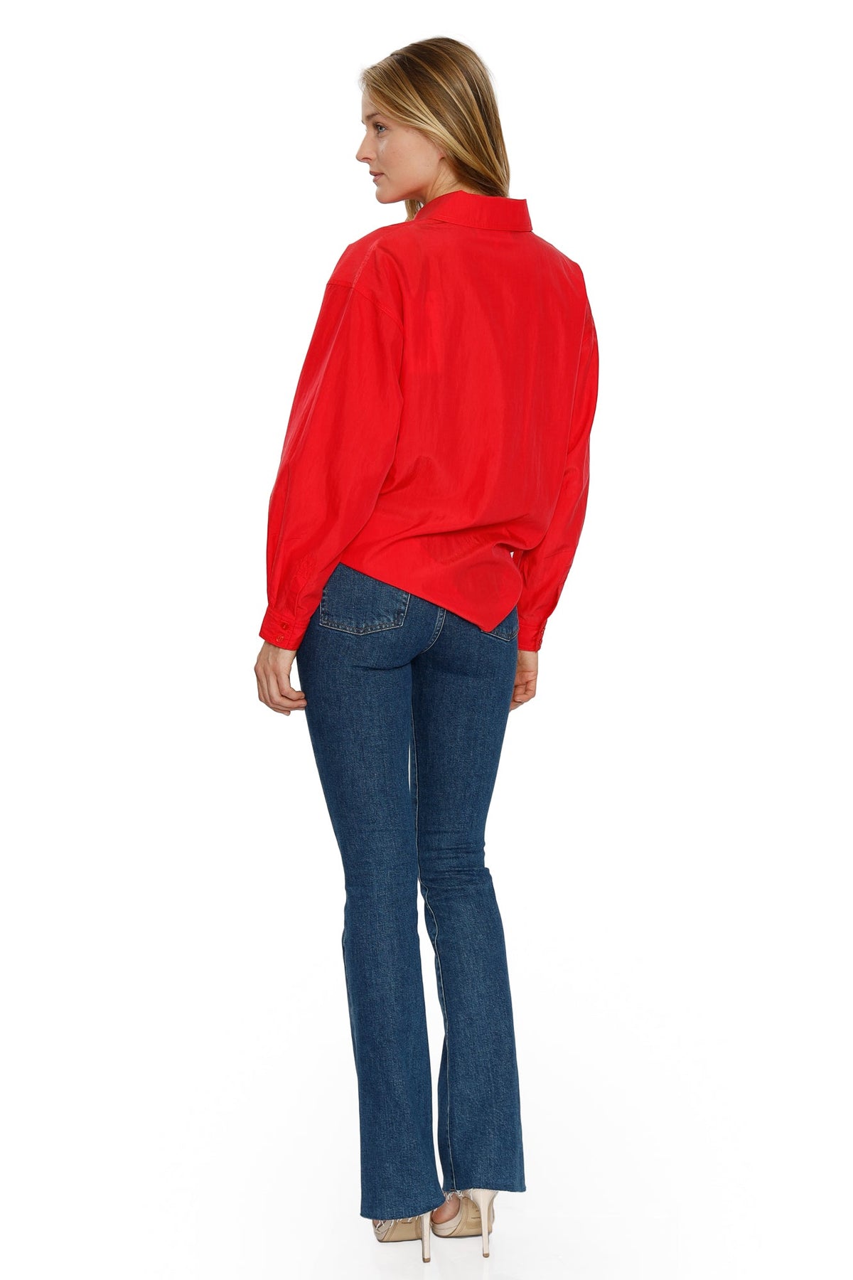 Back view of the blue Farrah flared jeans worn with a red blouse