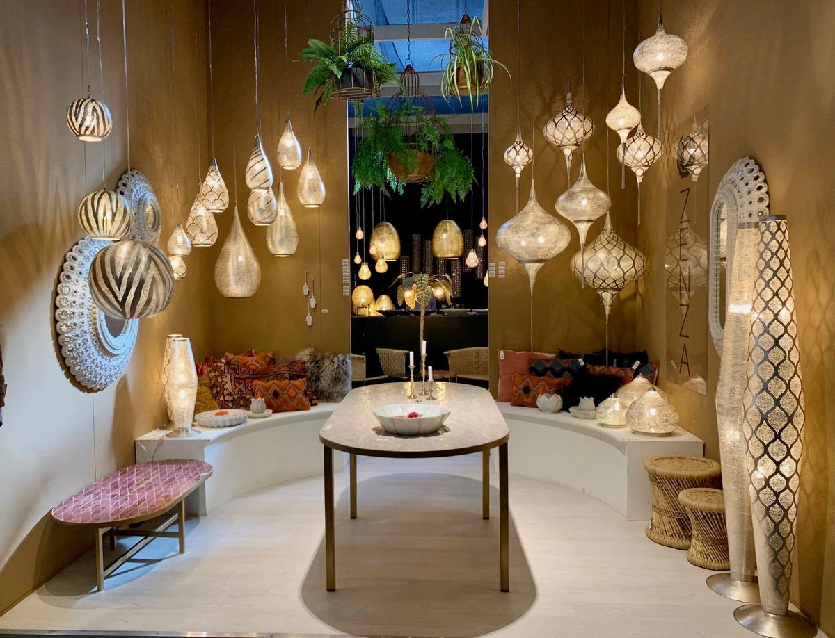 Zenza showroom with hanging lanterns and a tall Moorish floor lamp among other lights